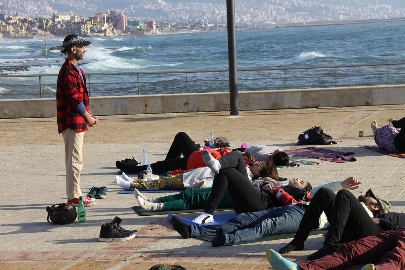 Participants resting on mats during a session